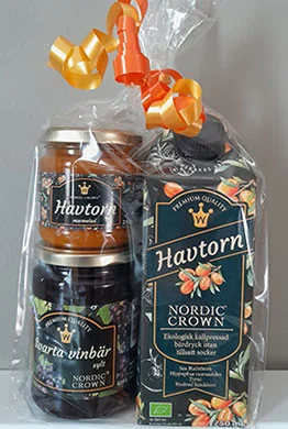 Presentpåse med Nordic Crown havtornsprodukter och guldband